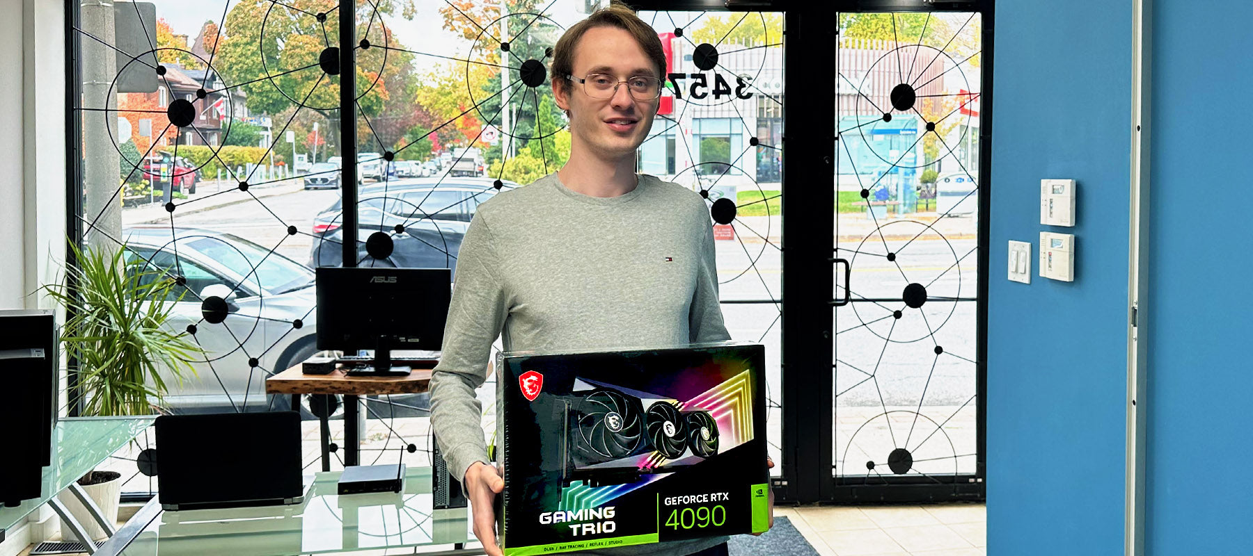 Guy Holding a 4090 GPU