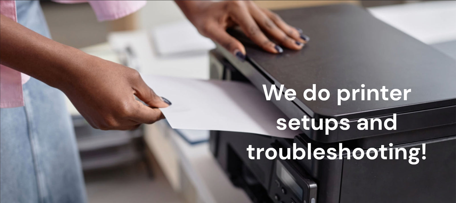 picture of printer on desk with laptop beside it